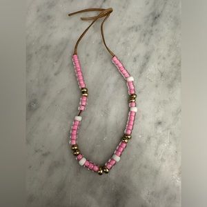 Pink and gold beaded necklace.